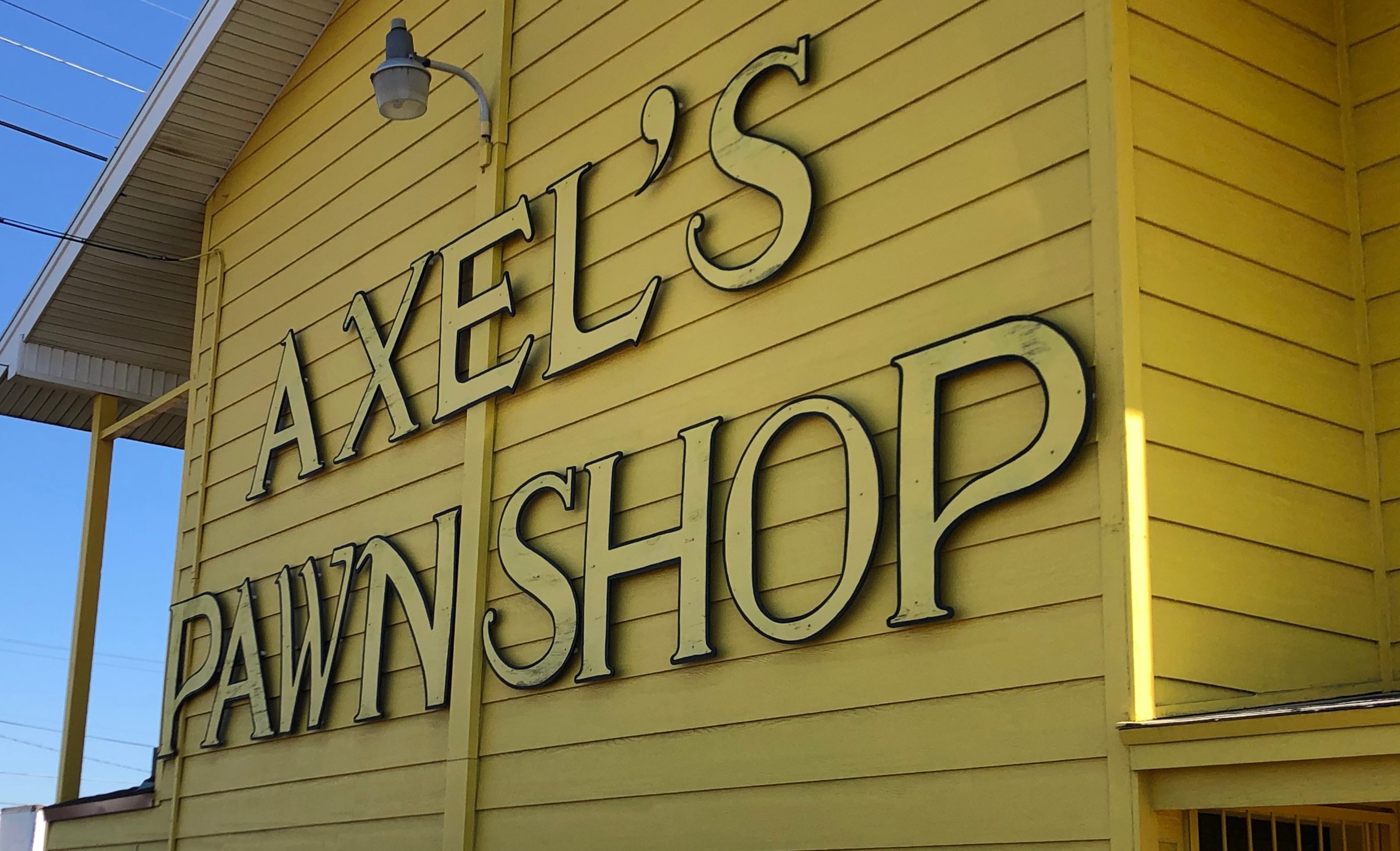 Axels Pawn Sign On Store Front