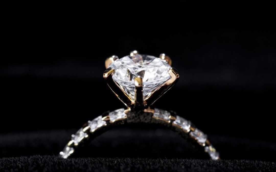 Closeup of diamond ring on black background