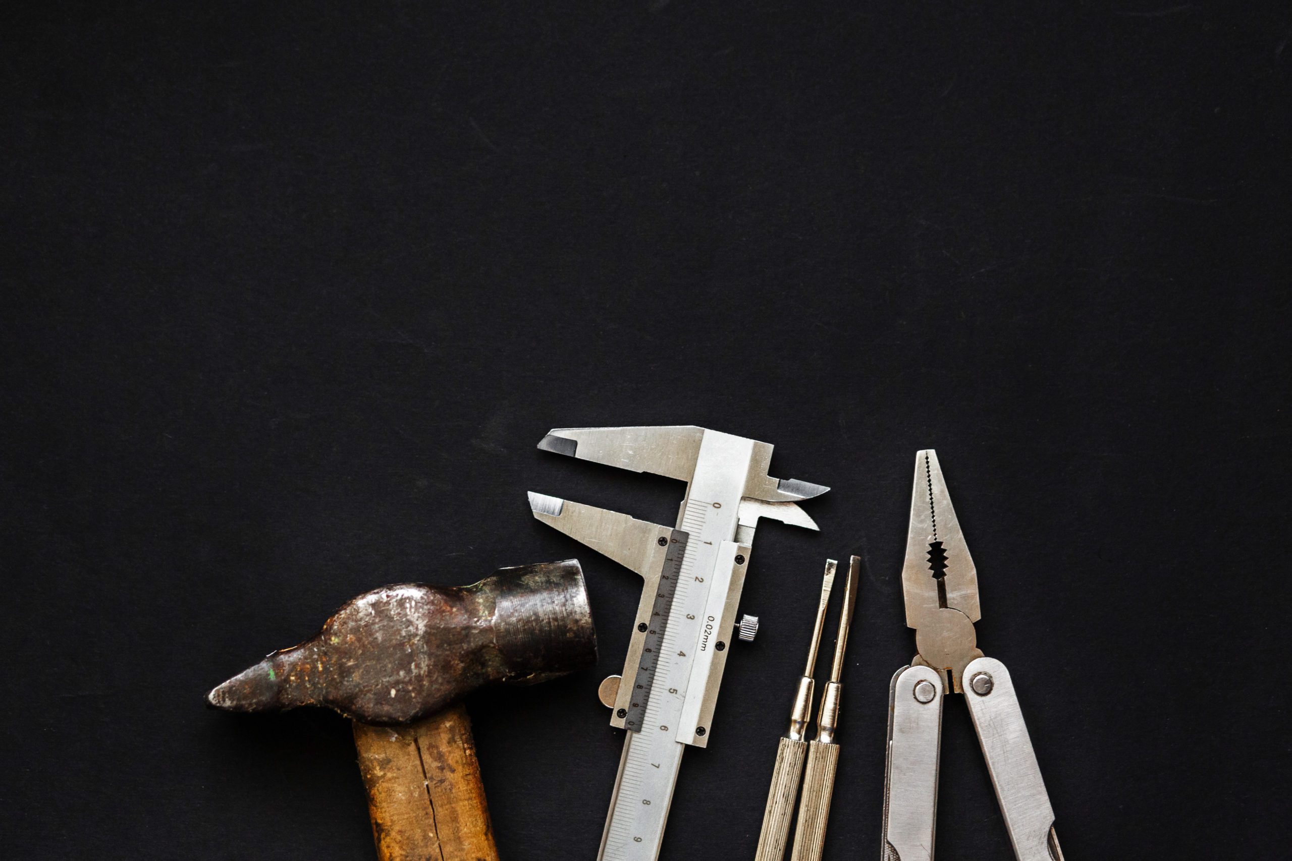 Pre-owned hand tools on black background